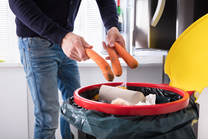 throwing carrots away food waste