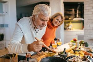 older people cooking together - image for cholesterol food fact sheet