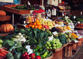 In Britain we're lucky enough to grow some fantastic fruit and vegetables. This image shows a greengrocers' fruit and veg stall with seasonal produce.