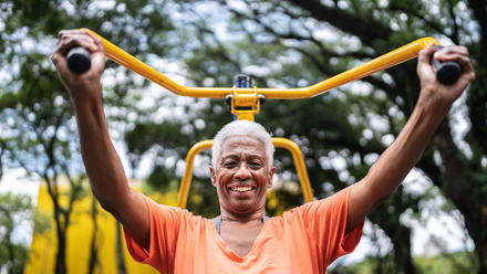 Portrait of a senior woman exercising in the park - stock photo