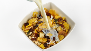 cow's milk allergy and suitable milk for those with a milk allergy fact sheet. Image shows a bowl of cereal with pouring milk