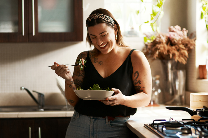 Woman eating salad